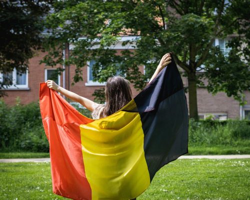 portrait-of-a-girl-with-a-belgian-flag-in-the-park-2025-03-06-01-37-24-utc(1)